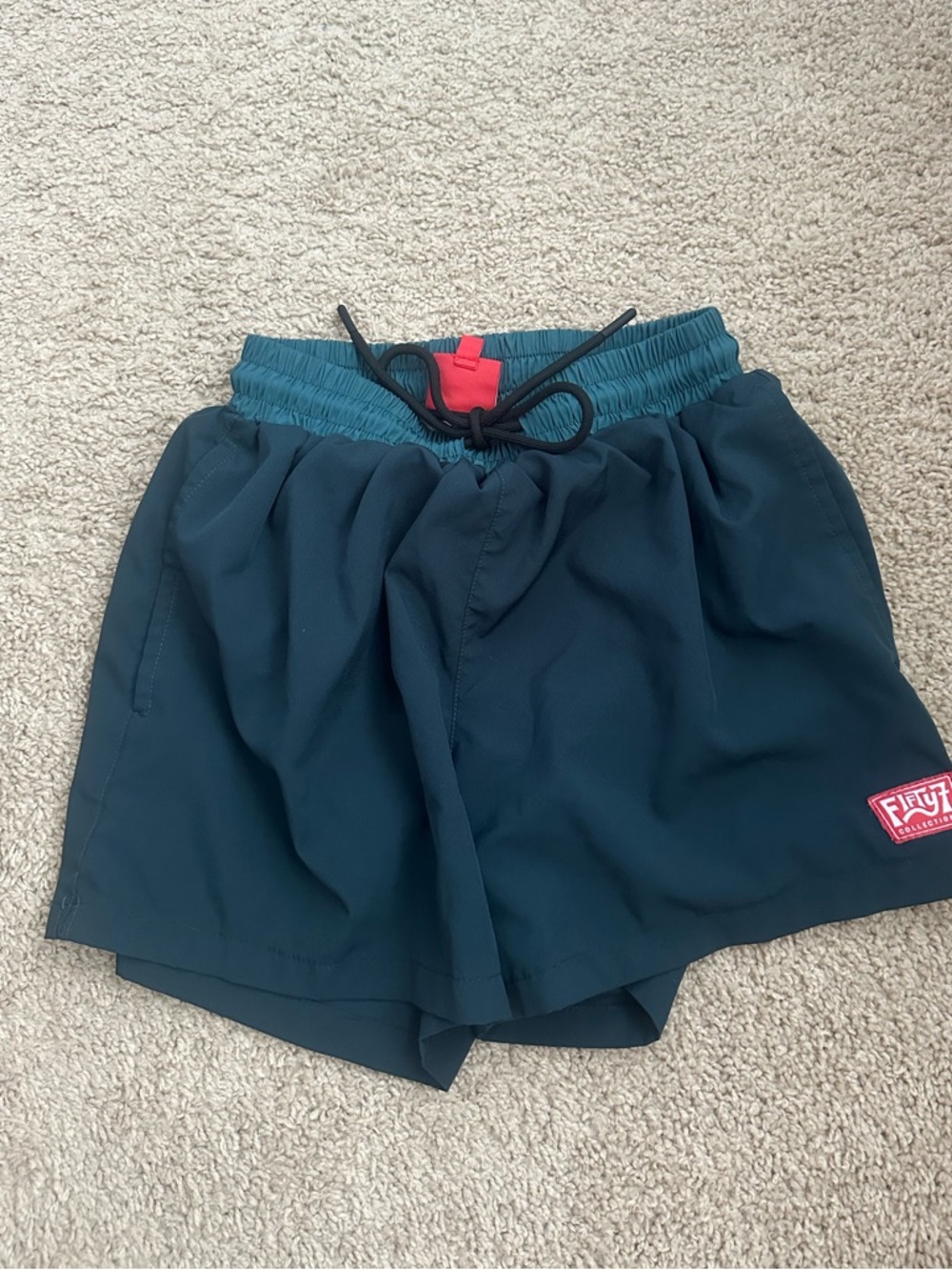 Dark teal surf shorts